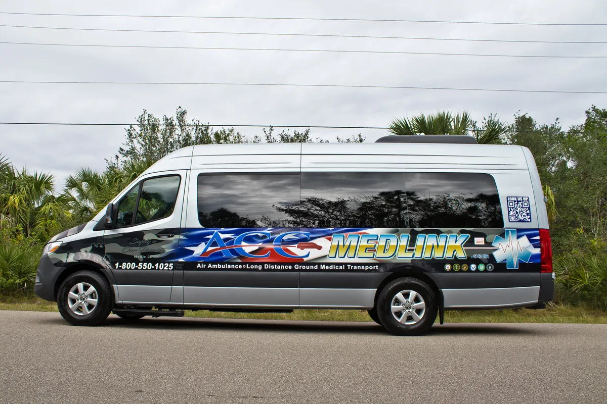 Side view of an ACC Medlink Mercedes Sprinter medical transport van