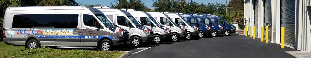 Row of ACC Medlink Mercedes Sprinter medical transport vans