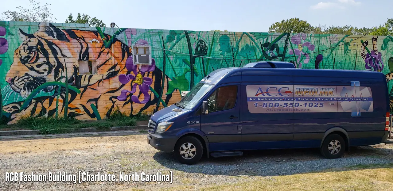 ACC Medlink transport van beside a tiger mural in Charlotte, North Carolina
